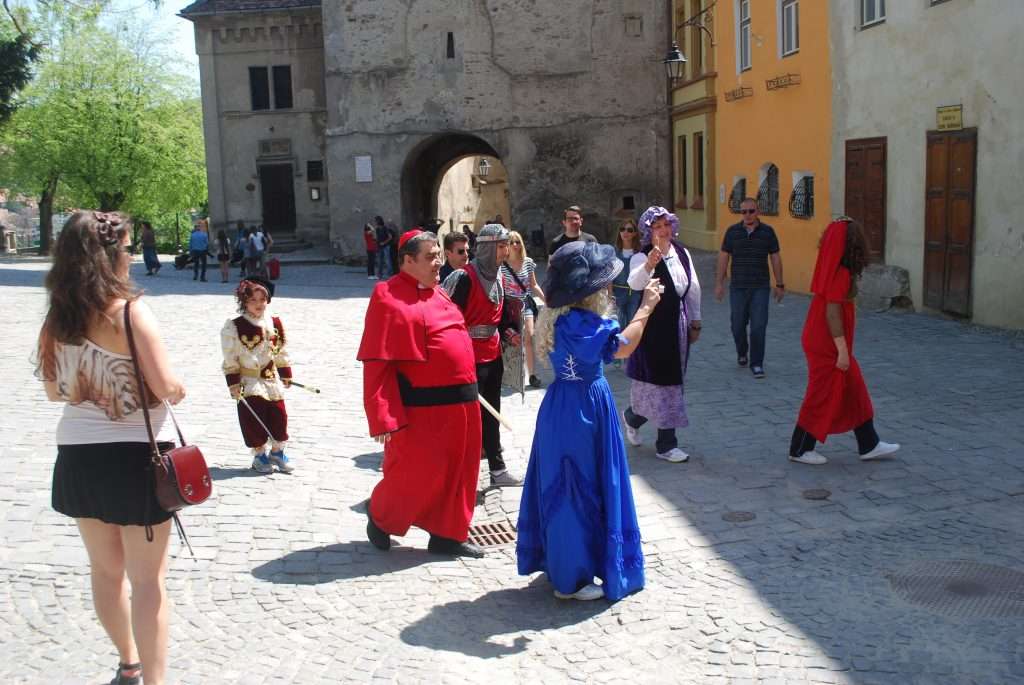 Medieval princess, priest, peasants and knight in Sigisoara
